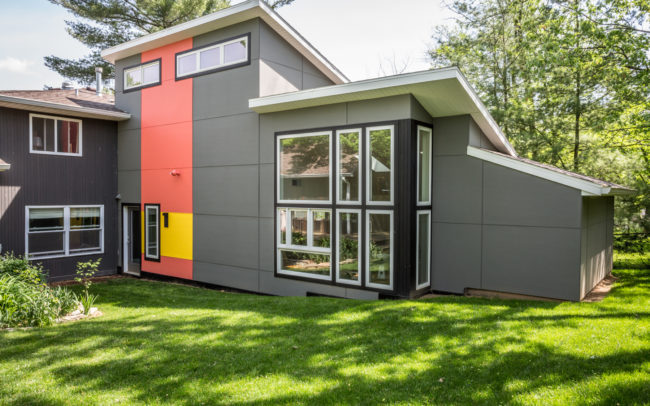 A modern home with a colorful exterior.