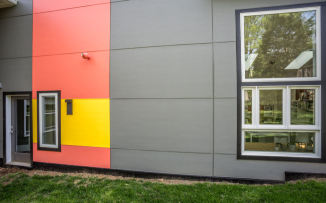 The exterior of a house is painted in bright colors.